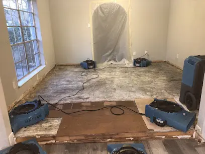 A room being dried with containment and an air mover in Arlington, TX