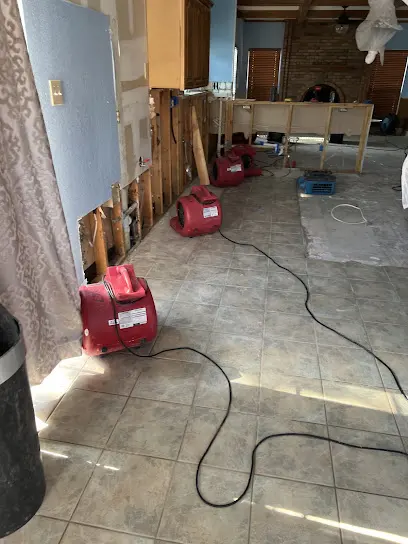 Air movers and dehumidifiers drying an Arlington, TX room